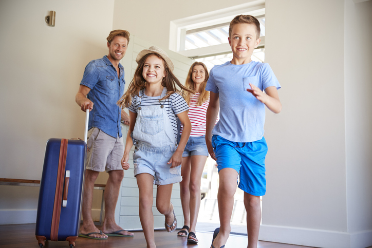 Family Arriving At Summer Vacation Rental Family Arriving At Summer Vacation Rental