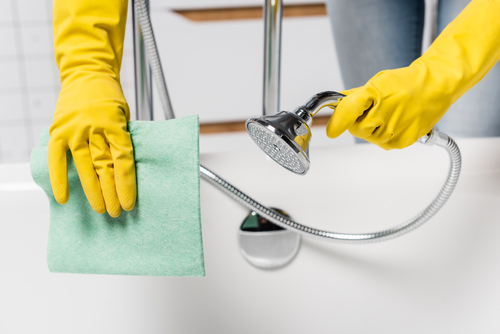 What should I avoid doing when cleaning the bathroom