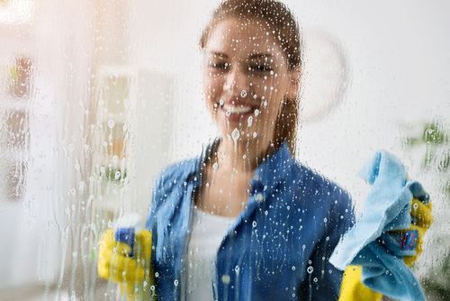 How do professionals clean inside windows