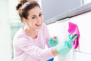 Charlotte homeowner using smart cleaning tips to keep their living room organized