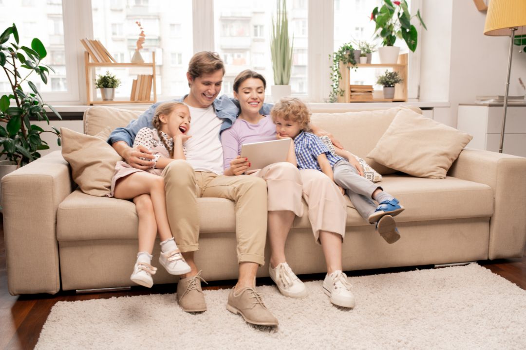 Happy family enjoying professional home care for a sparkling environment