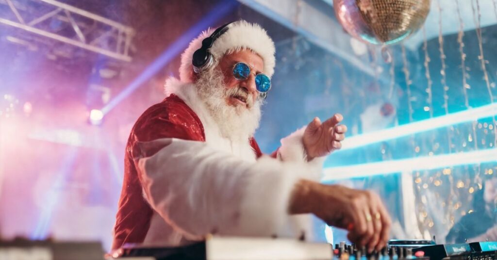 santa at the turn table during a christmas party