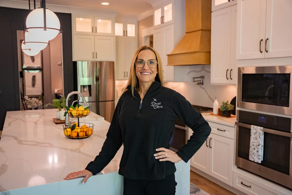 Jamie Reader, owner of Dust and Mop House Cleaning, in a clean kitchen
